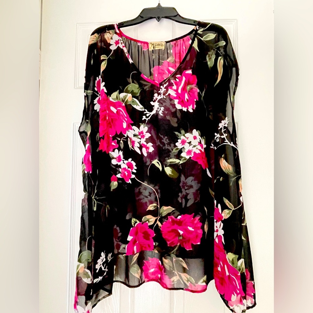 Cute boho flowy shirt that layers great over a mini dress or paired with jeans.